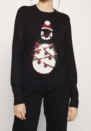 Black knit sweater featuring a penguin design with red and white sequins, and a red hat with a white pom-pom. Ribbed cuffs and waistband.
