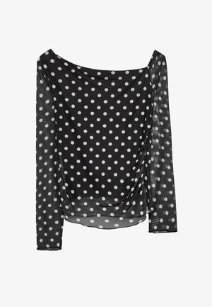 Schwarzes, transparentes Langarmshirt mit weißen Polka-Dots, mit einem drapierten Design an der Vorderseite und weiter Ausschnitt. Glatte Textur über die gesamte Oberfläche.
