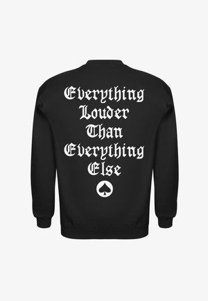 Black sweatshirt with white gothic text reading "Everything Louder Than Everything Else" and a spade symbol below the text on the back.