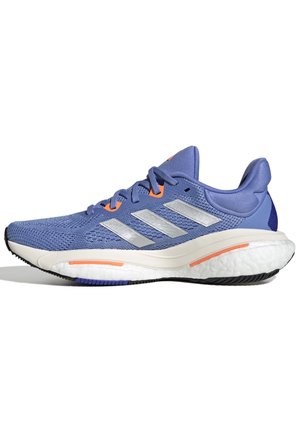 Blue athletic shoes with mesh upper, silver stripes, and orange accents. Curved white midsole and black rubber outsole for traction.