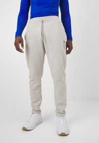 Champion ICONS HEM PANTS - Treniņtērpa apakšdaļas - silver lining