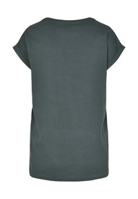 T-shirt gris foncé avec des manches courtes retournées, un col rond et un ourlet droit. Fabriqué en coton doux, design minimaliste.