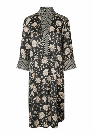 Robe noire à fleurs beige et blanches, manches trois-quarts, motif géométrique contrastant sur le col, les poignets et la patte de boutonnage.