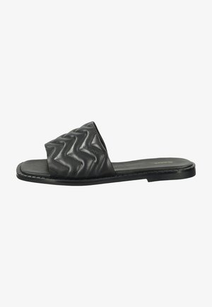 Black slide sandal with a padded, zigzag-patterned upper made of faux leather. Flat sole with stitched detailing, wide strap design.