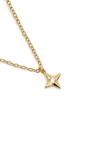Goldene sternförmige Anhänger-Halskette mit einem zentralen klaren Edelstein, die ein zartes Kettendesign und eine glänzende Oberflächenstruktur aufweist.
