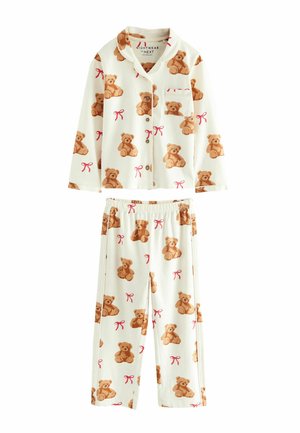 Conjunto de pijama de algodón con un fondo blanco y estampado de ositos de peluche marrones y lazos rosas. Incluye una camisa de botones con cuello y pantalones a juego.