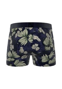 Boxers en tissu navy à motifs floraux avec une coupe ajustée, ornés de grandes fleurs vertes et crème, et d'une ceinture élastique noire.