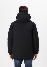 Tommy Hilfiger ROCKIE  - Piumino lungo - black