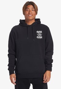 Black hoodie with front pocket, drawstring hood, and white graphic logo on the chest. Soft fabric with ribbed cuffs and hem. Casual fit.