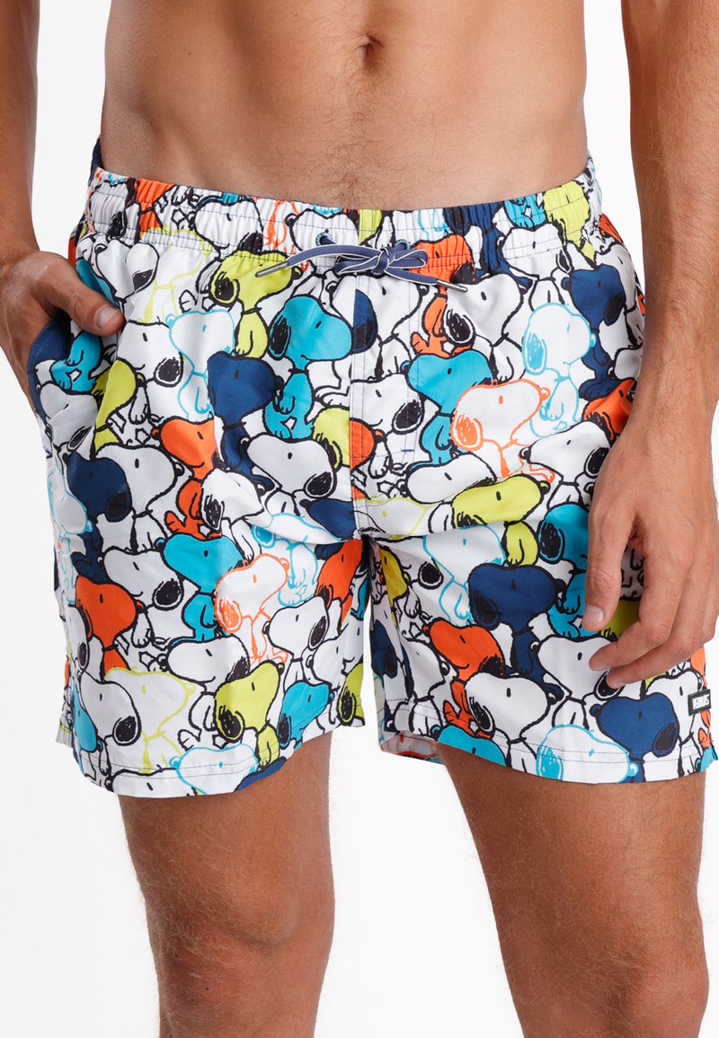 Bañador con un patrón colorido de perros de dibujos animados en azul, naranja, verde y negro sobre un fondo blanco. Cintura elástica con cordón.