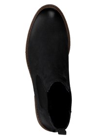 Bottine noire en cuir lisse avec des panneaux latéraux élastiques, dotée d'un bout arrondi et d'une semelle en caoutchouc marron avec des accents texturés.