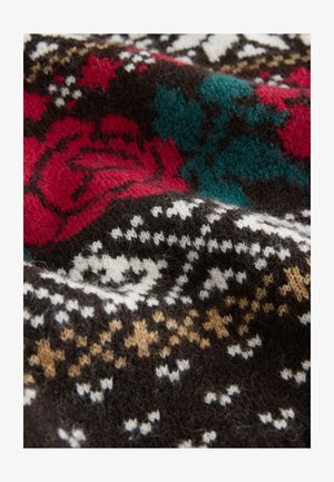 Tissu tricoté à motifs présentant des roses rouges, des accents turquoise et des motifs géométriques blancs sur un fond sombre, créant une apparence texturée.