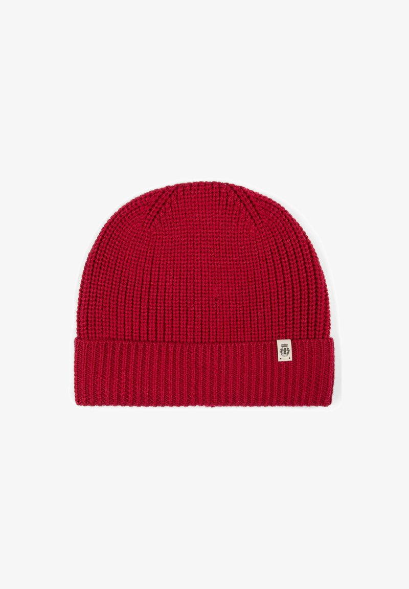 Red knit beanie with a ribbed texture and a folded brim. Features a small branded tag on the side.