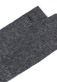 Dark gray knitted fingerless gloves with a thumb hole, laid flat on a white background.