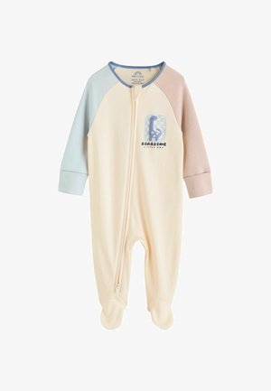 Svetlo krémový overal s modrými a ružovými raglánovými rukávmi, zipsovým uzáverom, zakrytými nohavicami a grafikou "Úžasný malý" na hrudi.