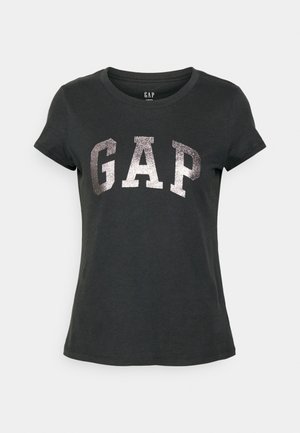 Czarna damska koszulka z krótkim rękawem i srebrnym błyszczącym logo "GAP" na środku z przodu.