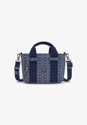 Navy blue bag featuring textured fabric with a diamond pattern, short handle, adjustable strap, and a decorative charm attached.