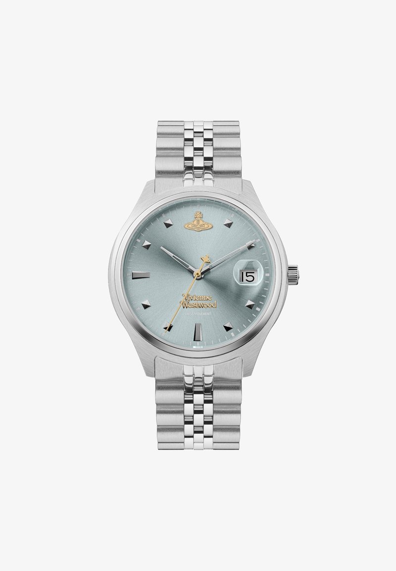 Strieborné náramkové hodinky s okrúhlym ciferníkom, svetlomodrým textúrovaným displejom, zlatými akcentmi, tyčovými indexami a zobrazením dátumu. Nerezový oceľový náramok.