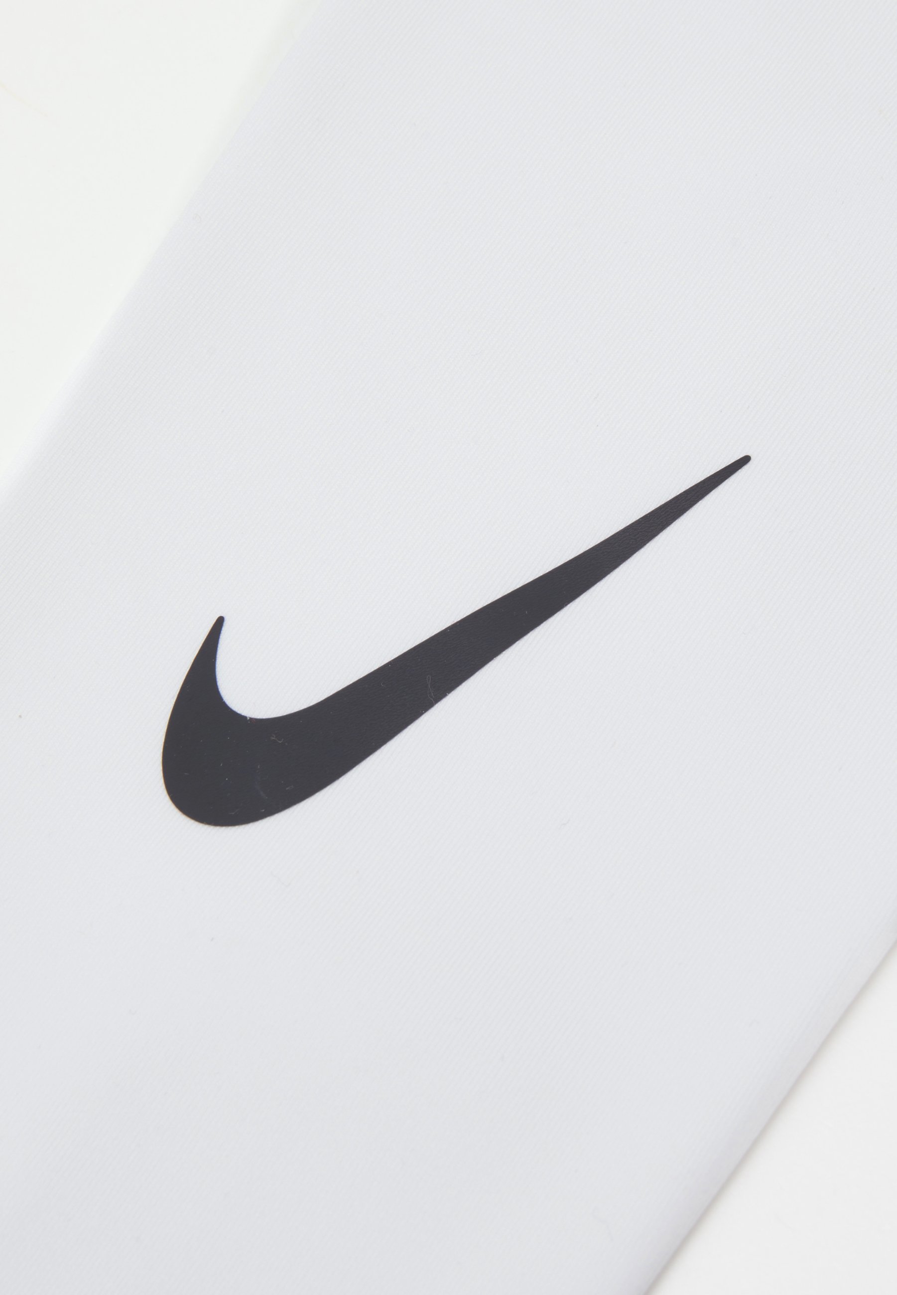 white nike forearm sleeve