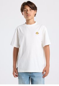 White cotton t-shirt featuring short sleeves, a crew neck, and a small multicolored "Lakers" logo on the left chest. Worn with light blue jeans.