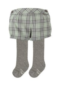 Pantalones cortos a cuadros verdes con una cintura alta y dos botones, combinados con medias de punto grises. Los pantalones cortos tienen un detalle de dobladillo doblado.