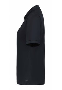 Schwarzes Poloshirt mit kurzen Ärmeln, Kragen und Reißverschluss vorne. Hergestellt aus strukturiertem Stoff mit einem logo detail nahe dem Saum.
