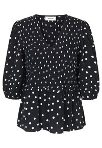 Schwarze Bluse mit weißen Polka-Punkten, mit V-Ausschnitt, gerafftem Oberteil und Puffärmeln. Ausgestellt geschnitten mit texturierten Stoffdetails.