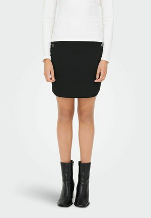 Black mini skirt with a fitted design and side buttons, paired with knee-high black leather boots, featuring a square toe and smooth texture.