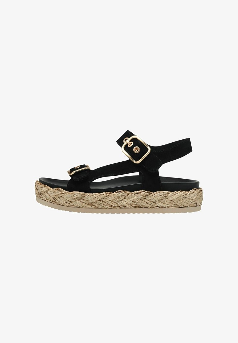 Sandale noire avec deux brides à boucle dorée et semelle plateforme en fibres naturelles tressées sur fond blanc.
