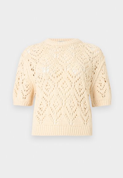 Pull tricoté à manches courtes de couleur crème avec un motif en dentelle losange et un ourlet et des poignets côtelés.