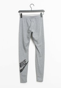 Gray leggings made of soft cotton blend, featuring an elastic waistband and a large black Nike logo printed on the lower left leg.