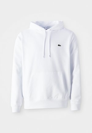 Witte hoodie met lange mouwen, vooraan een kangoeroezak, een capuchon met trekkoord en een klein groen krokodillenlogo op de linkerkant van de borst.
