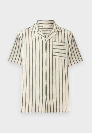 Chemise à manches courtes de couleur crème avec des rayures noires verticales, boutonnée à l'avant, col style camp et poche poitrine avec des rayures horizontales.