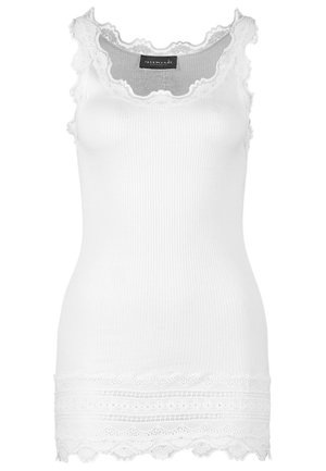 White ribbed tank top with lace trim at the neckline and hem. Features a fitted shape and soft texture. Brand label visible at the top.