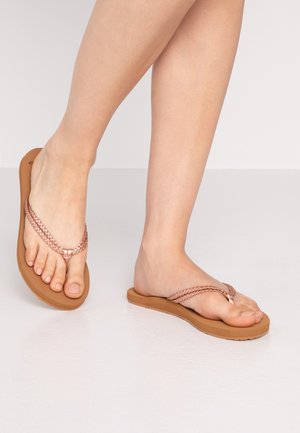 Rose gold braided straps and a brown flat sole characterize these thong sandals, designed for casual wear and comfort.