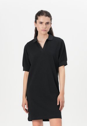Black polo dress with short sleeves, made from a smooth fabric. Features a collar and a straight cut, ending above the knee.