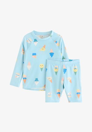 Lyseblå børnetop med lange ærmer og shorts med farverige mønstre af smilende isvafler og ispinde.