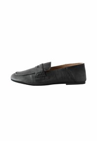 Black leather flat loafer with penny strap and pointed toe, shown in side profile on white background.