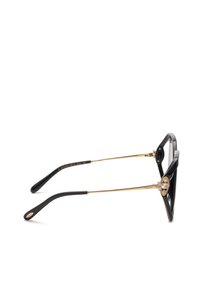 Lunettes noires et dorées avec des branches en métal fines et des détails décoratifs sertis de bijoux sur le côté près des charnières.