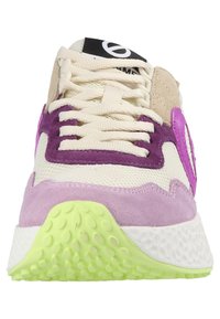Sneakers with a mesh upper in cream, purple suede accents, and a lime green rubber sole. Features prominent branding on the tongue.