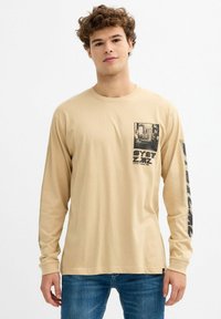 INSIDE PRINT GRÁFICO EN LAS MANGAS - Camiseta de manga larga - beige