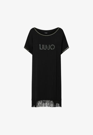 Vestido negro de manga corta con escote, bordes de las mangas y logo delantero adornados con tachuelas, con detalle de flecos en el bajo.
