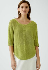 Green knit sweater with a wide neckline, three-quarter sleeves, a loose fit, and a textured finish, edged with a subtle stitch detail.
