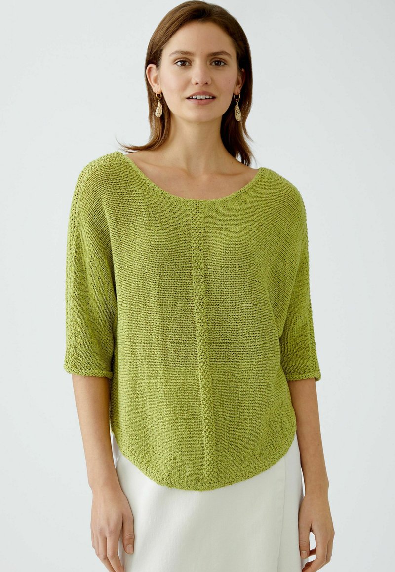 Green knit sweater with a wide neckline, three-quarter sleeves, a loose fit, and a textured finish, edged with a subtle stitch detail.