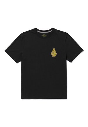 T-shirt in cotone nero con colletto rotondo, caratterizzata da una piccola grafica a forma di diamante gialla e nera sul lato sinistro del petto. Maniche corte, vestibilità classica.