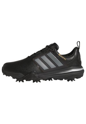 Sort atletiksko med tekstureret overdel, tre grå sidestriber, Gore-Tex label og robust sål med knopper for greb.
