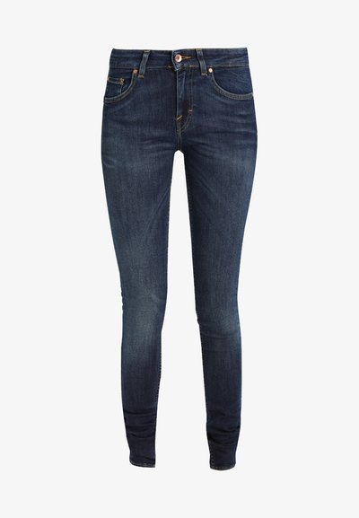 Ženske skinny kavbojke v temno modrem denimu z gladko teksturo, z petimi žepi in detajli iz bakra. Klasičen slog z oprijetim silhueto.