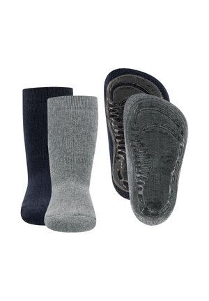 Two pairs of no-show grip socks in dark blue and gray, showing both front and sole with textured anti-slip patterns.