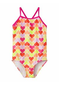 Bañador de una pieza en colores brillantes, con un patrón de corazones. Hecho de tela suave con tirantes y ribete en rosa.