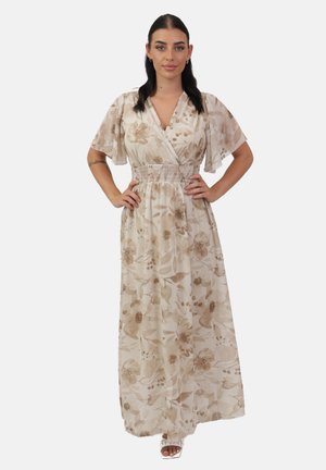 Robe maxi en tissu léger couleur crème avec un imprimé floral dans des tons beiges. Elle présente un design à envelopper, des manches courtes volantées et une taille froncée.